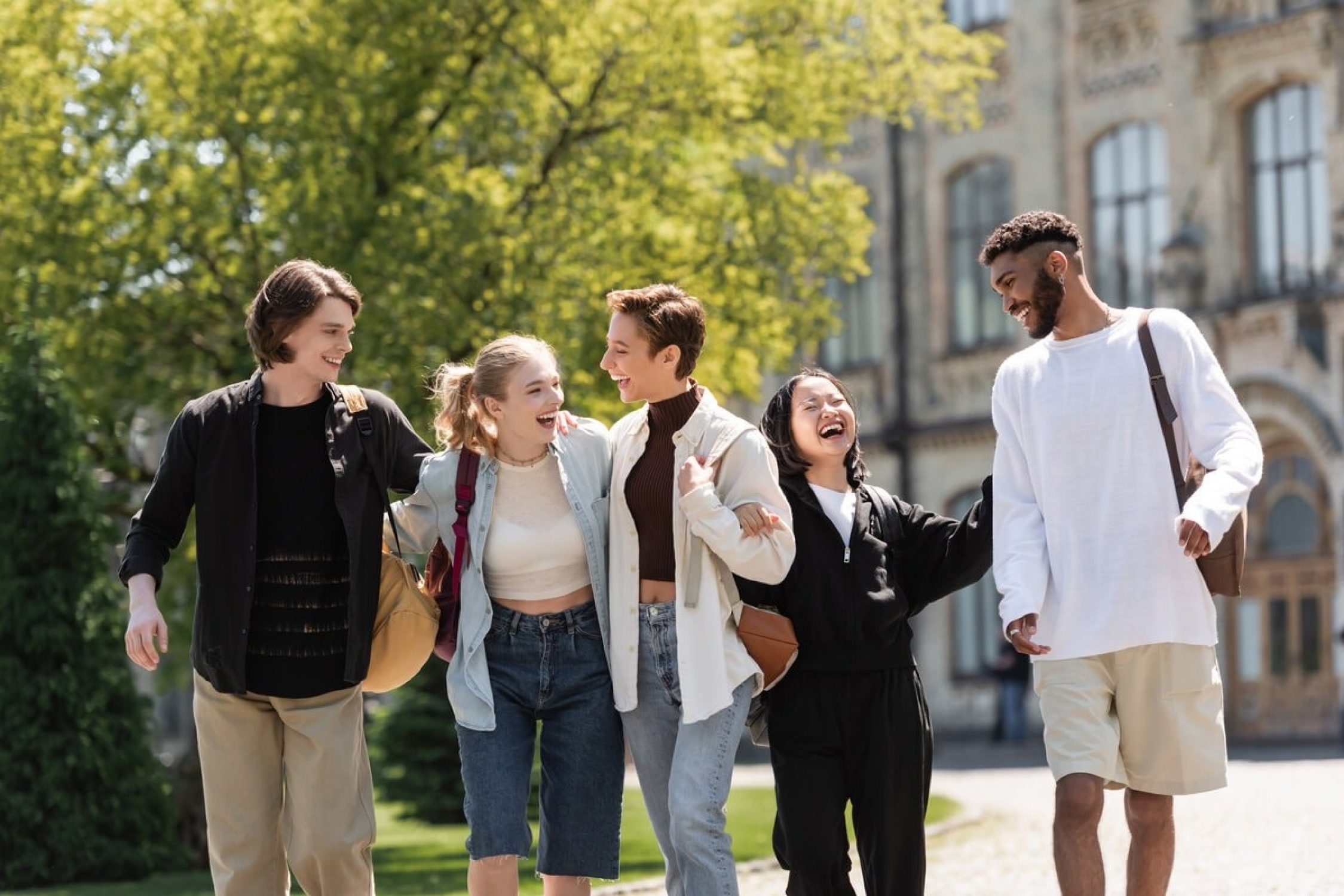 Students laugh on campus.